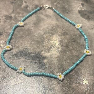 Charming Blue Beaded Necklace with Floral Details